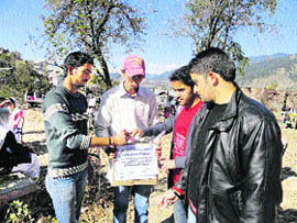 Students collect money on the campus of Government Degree College, Bhaderwah