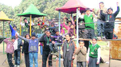 Students of Delhi Public School (in green sweaters) enjoy picnic with special kids of Darpan at Nehru Rose Garden.