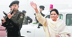 Uttar Pradesh Chief Minister Mayawati waves to supporters at a function in Lucknow on Tuesday.