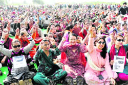 Teachers of government-aided colleges from Punjab and Chandigarh stage a protest in support of their demands at Sector 25 in Chandigarh