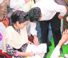 Haryana minister Kiran Chaudhary attends to public grievances at Bothan Kalan village in Fatehabad district on Wednesday.