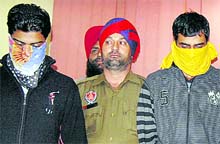 Gurvider Singh and Karan Kumar in police custody in Jalandhar on Wednesday