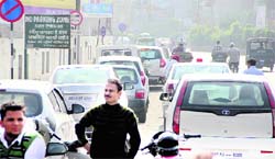 As traffic police turns a blind eye towards violations, people park vehicles in a no-parking zone near Company Bagh Chowk in Jalandhar