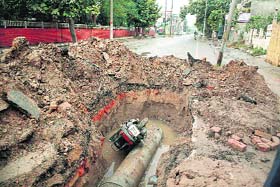 The 19-year-old girls scooter lies in a pit, dug in the middle of a road, at the H Block of BRS Nagar, Ludhiana, on Wednesday
