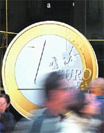 A restaurant displays a giant sticker of a euro coin on its window, offering pizzas for 1 in the centre of Madrid on Thursday. France and Germany drummed up support for their plan to fix the eurozone as European leaders geared up for a last chance summit to save the debt-laden currency union from collapse. 