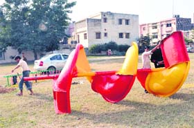 Swings being installed in a park at Sector 35 of Chandigarh