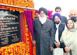 Punjab Chief Minister Parkash Singh Badal lays the foundation stone of a bridge near Sultanpur Lodhi on Thursday