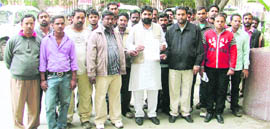 Activists of the Bhartiya Valmiki Sewa Dal at the municipal councils zone D office before submitting a memorandum to the Municipal Commissioner in Ludhiana on Thursday