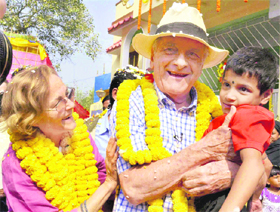French author Dominique Lapierre and his wife with an orphan child during a visit to Asha Bhavan Centre at Uluberia in Howrah district of West Bengal.