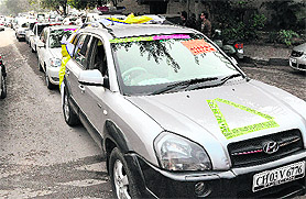 Members of the Joint Action Committee of Trade Industry and MSME take out a car rally in support of their demands in Chandigarh on Friday.