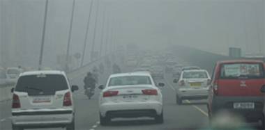Vehicles move through dense fog on NH-8 in Gurgaon on Friday.
