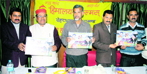 Samar Bhandari (centre), secretary of the Uttarakhand CPI, releases a music album of Narendra Singh Negi (second from left), famous Garhwali folk singer, in Dehradun on Friday. 