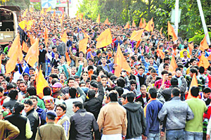Workers of the Akhil Bharatiya Vidyarthi Parishad take out a procession in Dehradun on Friday.