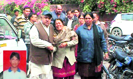 The grief-stricken mother of deceased Rajan (Inset) and other family members in Yamunanagar on Friday.