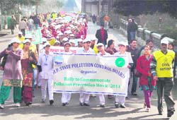 Students take out a rally to create awareness regarding conservation of environment in Shimla on Friday