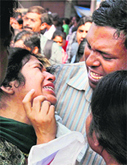 Relatives of a victim break down outside the AMRI Hospital in Kolkata on Friday.