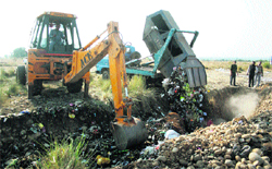 Municipal waste being dumped at Kangryl in Kot Bhalwal, 22 km from Jammu,