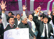 Members of the JK Bar Association hold a protest outside the High Court in Jammu on Friday.