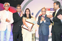 Ritu Singal after getting the Women Entrepreneur of the Year-2011 Award from NR Narayana Murthy, Chairman Emeritus, Infosys, in Mumbai.