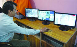 Monitors show footage from CCTV cameras installed at the bus stand in Amritsar