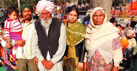 Lineman Sukhjit Singh along with his grand father Partap Singh,mother Manjit Kaur, wife Baljinder Kaur and son Gurtej during the on-going protest dharna in Bathinda on Saturday.