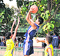 Players in action during the St Kabir Inter-School Basketball Tournament at Sector 26, Chandigarh, on Saturday. 