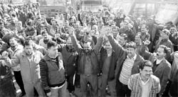 HRTC employees hold a protest at the old bus stand in Shimla on Saturday