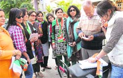 Women campaign for a Congress candidate in Sector 19, Chandigarh, on Sunday