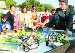 A student explains his model to visitors during a science exhibition at The Millennium School in Mohali on Sunday