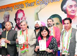 MP Pawan Bansal (centre) releases Congress manifesto in Chandigarh on Sunday