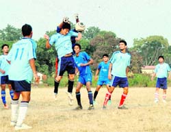 A match in the Abhishek Dabral Memorial Football Tournament under way in Dehradun on Sunday