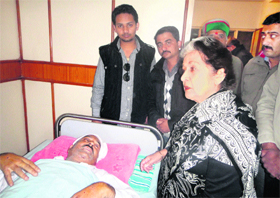 Congress CLP leader Vidya Stokes visits state Congress chief Kaul Singh Thakur, who was injured in a car accident, at the IGMC Hospital in Shimla on Sunday.