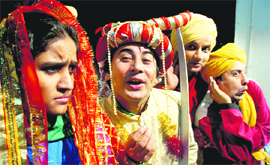 Artistes enact a play Suno Ek Kahani at Natrang Studio Theatre in Jammu on Sunday.