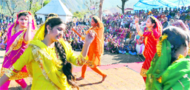 Girls perform on the second day of the Nagot Cultural Festival at Bakkal in Reasi on Sunday.