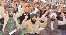 Draughtsmen raising slogans in support of their demands in Bathinda on Monday.