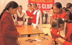 Students of the Baba Farid Senior Secondary School preparing jewellery from vegetables during a competition in Bathinda on Monday.