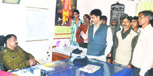 Circle Officer Ajay Singh listens to small-scale traders in Haridwar on Monday. 