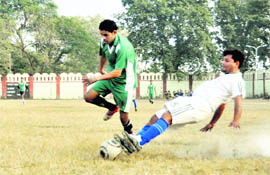 A match under way in the Abhishek Memorial Football Tournament played at Survey Stadium in Dehradun on Monday. 