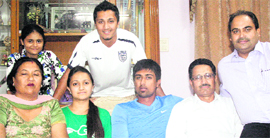 A file picture of Rahul Sharma (in blue T shirt) with his family at his residence in Jalandhar.