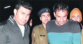 Ranjit Singh Dhillon (left) and Jarnail Singh being taken to the crime branch office at Sector 11 in Chandigarh on Tuesday.