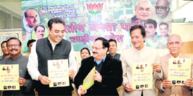 Jagat Prakash Nadda, National General Secretary, BJP (centre), releases partys manifesto for the MC elections in Sector 33, Chandigarh, on Tuesday.