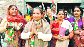 Kamlesh Kumari, Congress candidate from ward No. 24 (with folded hands), with her supporters at Ram Darbar in Chandigarh on Tuesday.