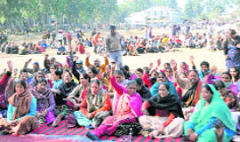 Striking class IV employees of the state government stage a dharna in support of their demands at the Parade Ground in Dehradun on Tuesday. 