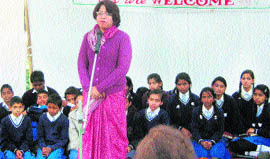 Students of Ferger School participate in a carol singing programme in Dehradun on Tuesday. 