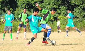 Players in action during the Abhishek Memorial Football Tournament in Dehradun on Tuesday. 