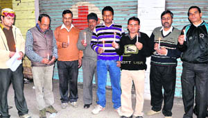 People pay tributes the Parliament attack martyrs at Ranipur in Haridwar on Tuesday. 