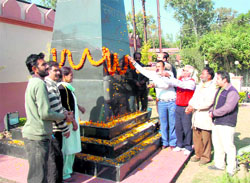 Members of the J&K Freedom Fighters Association pay floral tributes to the martyrs of the Parliament attack in Jammu on Tuesday