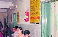 Fire extinguisher hung on the wall outside the X-ray room