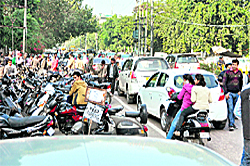 Vehicles parked on Mall Road in Ludhiana on Tuesday