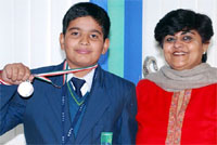 Sartaj Poonia shows the silver medal he won